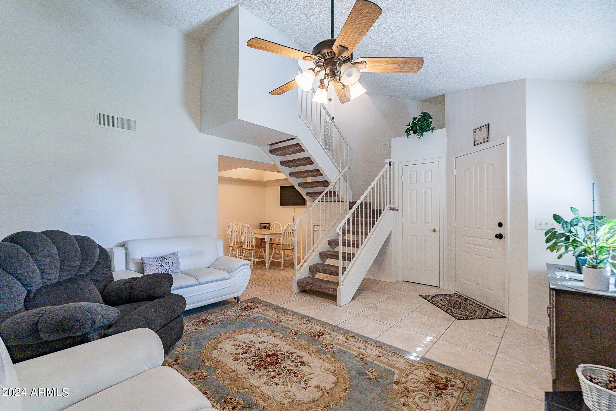 170 East Guadalupe Road, Unit 67 Gilbert, AZ 85234 - Photo 1 of 29 a living room with furniture and a potted plant