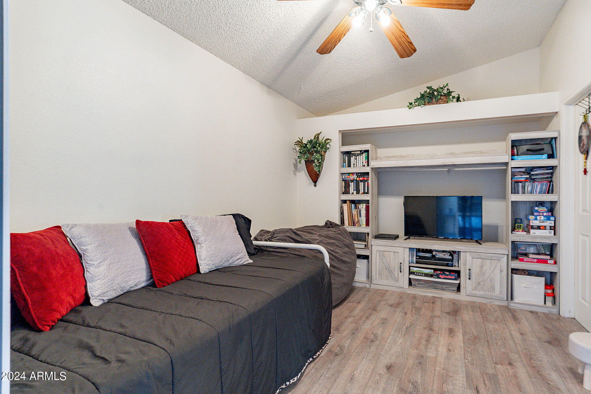 170 East Guadalupe Road, Unit 67 Gilbert, AZ 85234 - Photo 11 of 29 a living room with furniture and a flat screen tv
