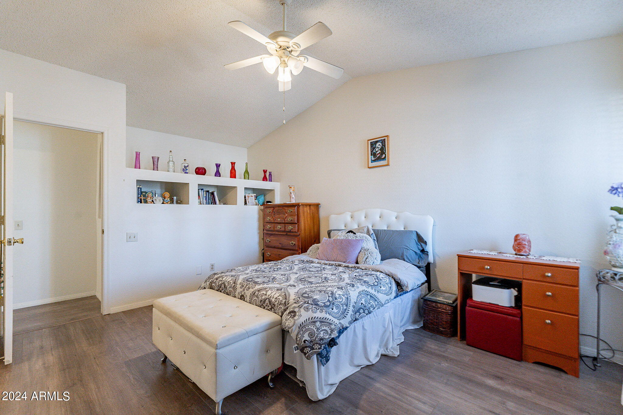170 East Guadalupe Road, Unit 67 Gilbert, AZ 85234 - Photo 17 of 29 a bedroom with a bed and wooden floor