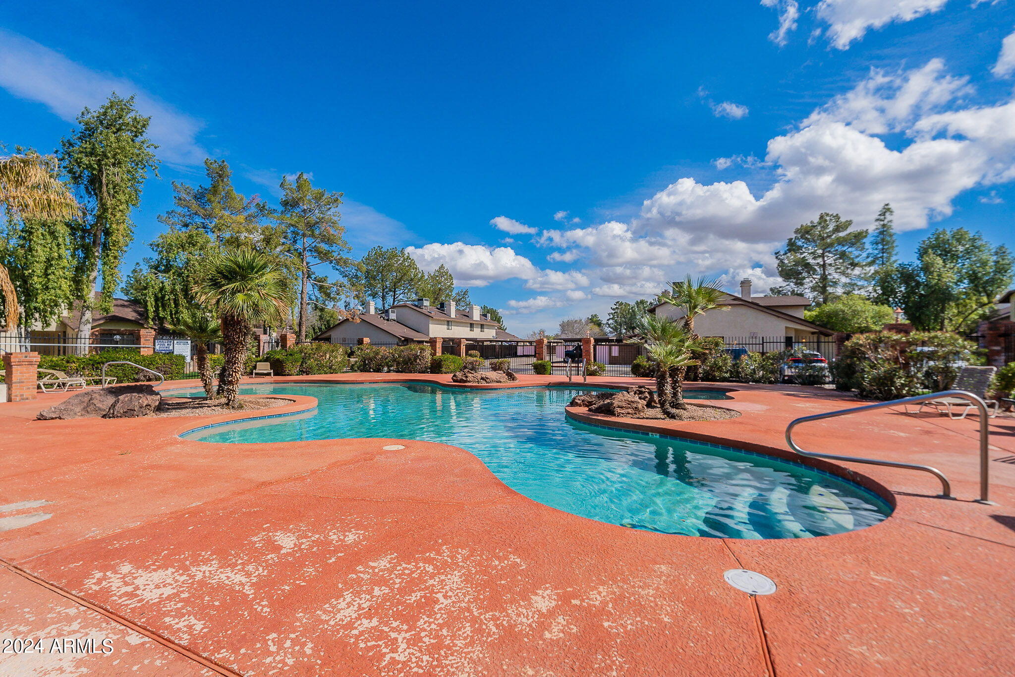 170 East Guadalupe Road, Unit 67 Gilbert, AZ 85234 - Photo 25 of 29 a view of a swimming pool and a yard