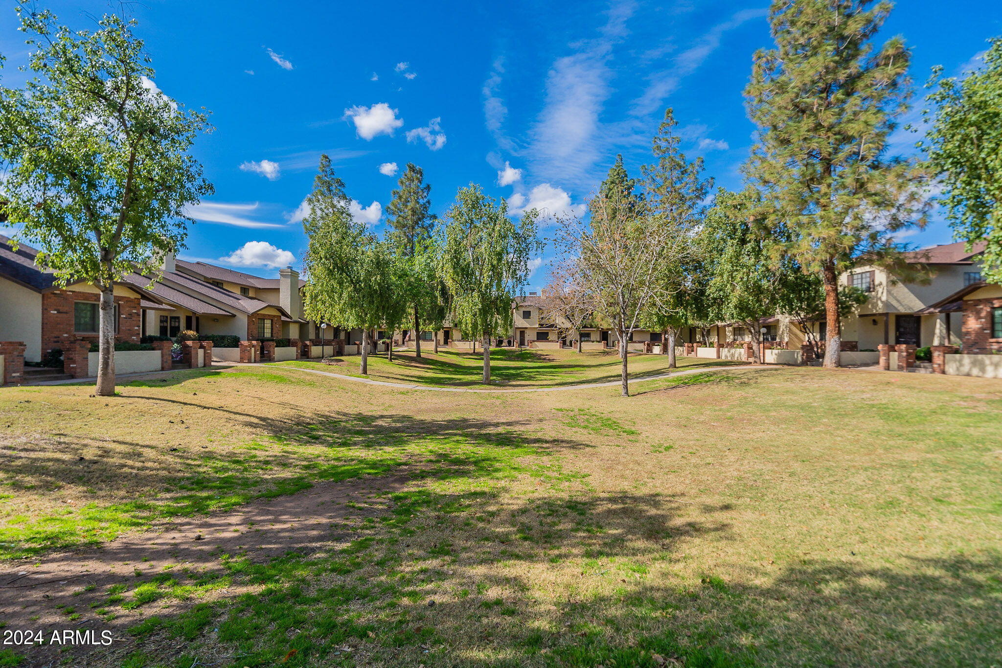 170 East Guadalupe Road, Unit 67 Gilbert, AZ 85234 - Photo 27 of 29 a swimming pool with outdoor seating and yard