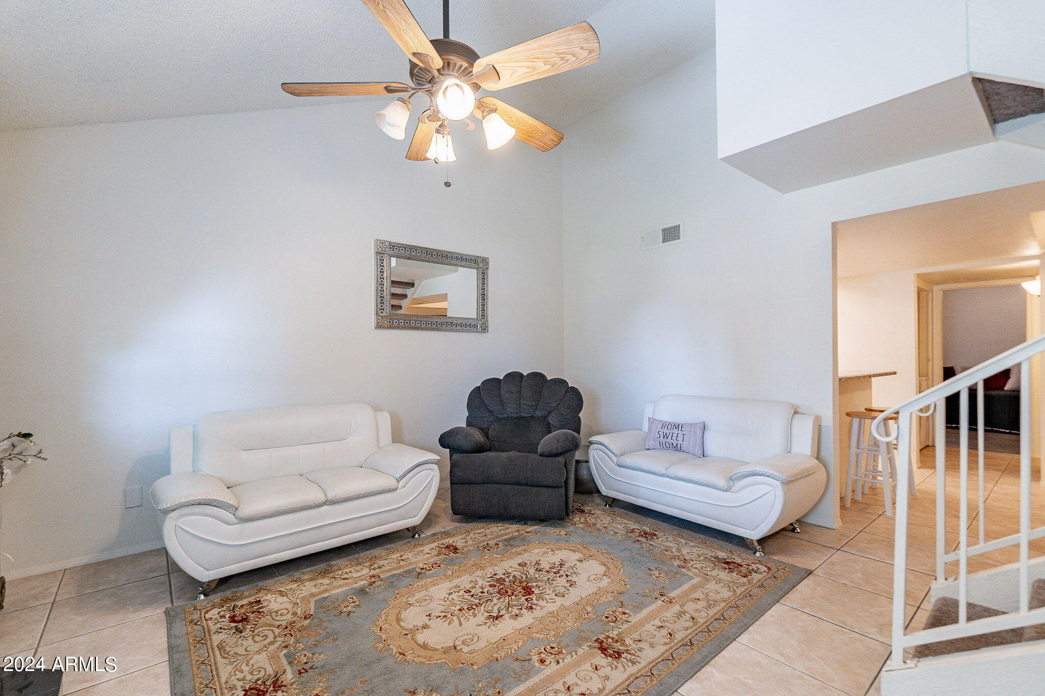 170 East Guadalupe Road, Unit 67 Gilbert, AZ 85234 - Photo 3 of 29 a living room with furniture a rug and a couch