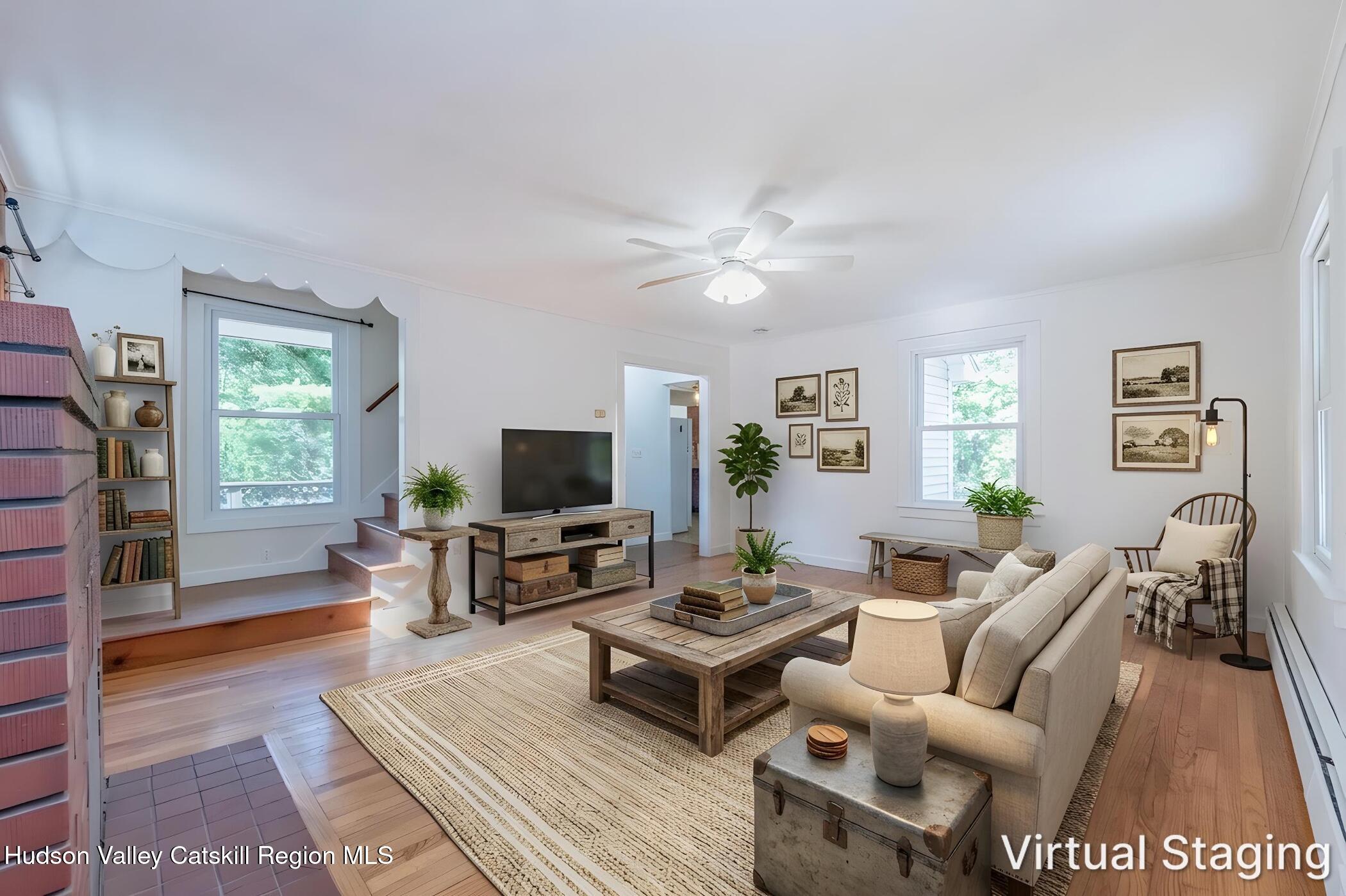 4533 Atwood Road Stone Ridge, NY 12484 - Photo 7 of 63 a living room with furniture a rug and a flat screen tv