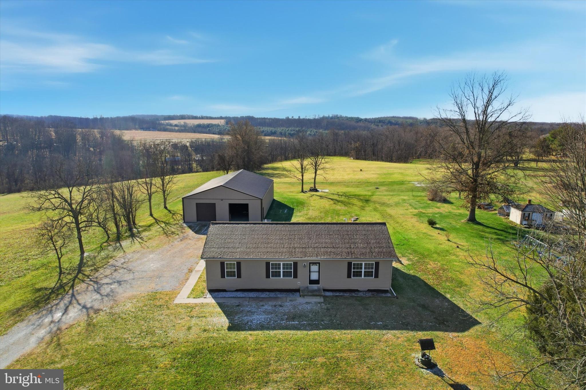 893 Georgetown Road Littlestown, PA 17340 - Photo 1 of 35 a view of a yard with an outdoor seating