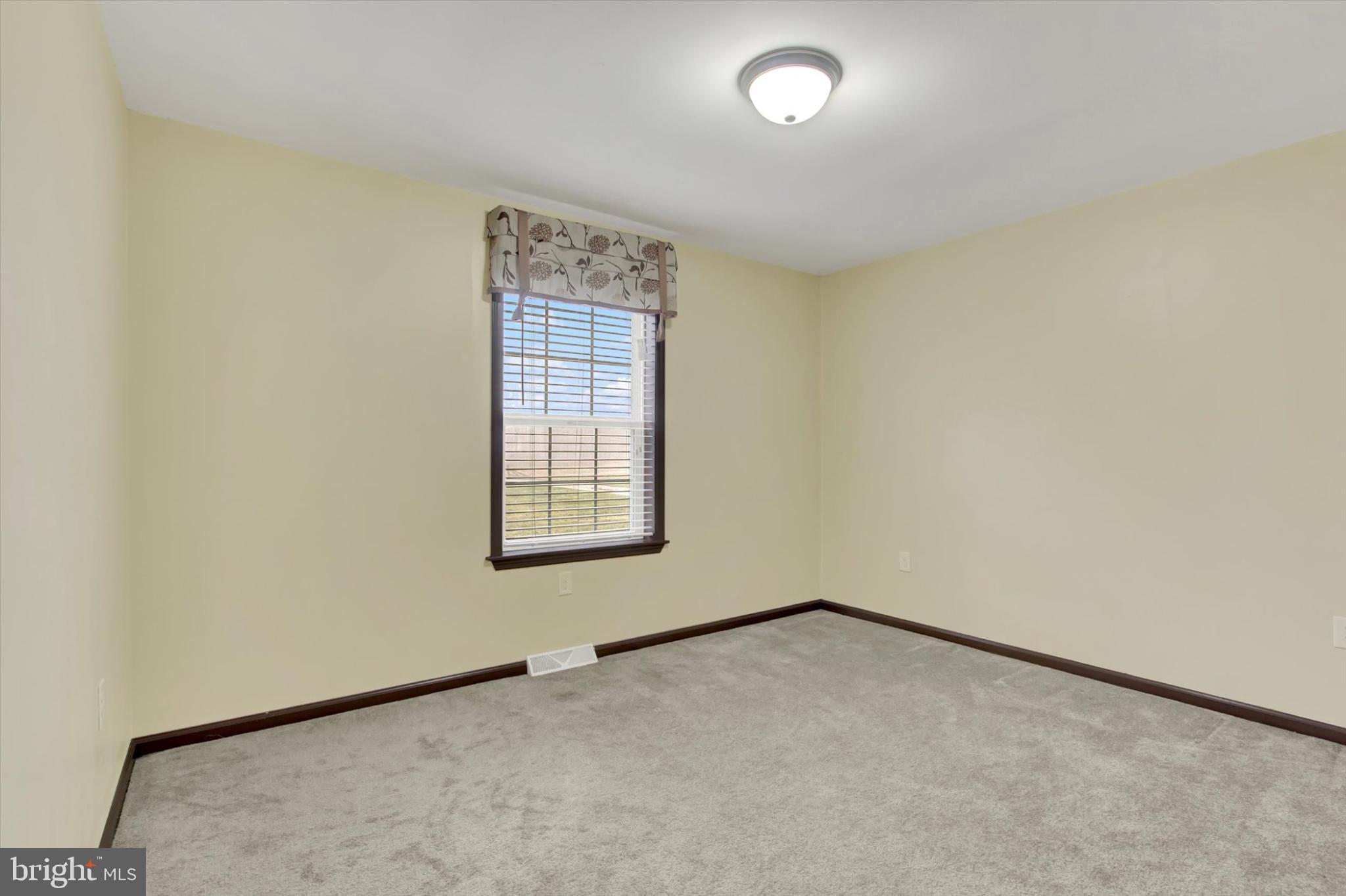 893 Georgetown Road Littlestown, PA 17340 - Photo 17 of 35 an empty room with a window