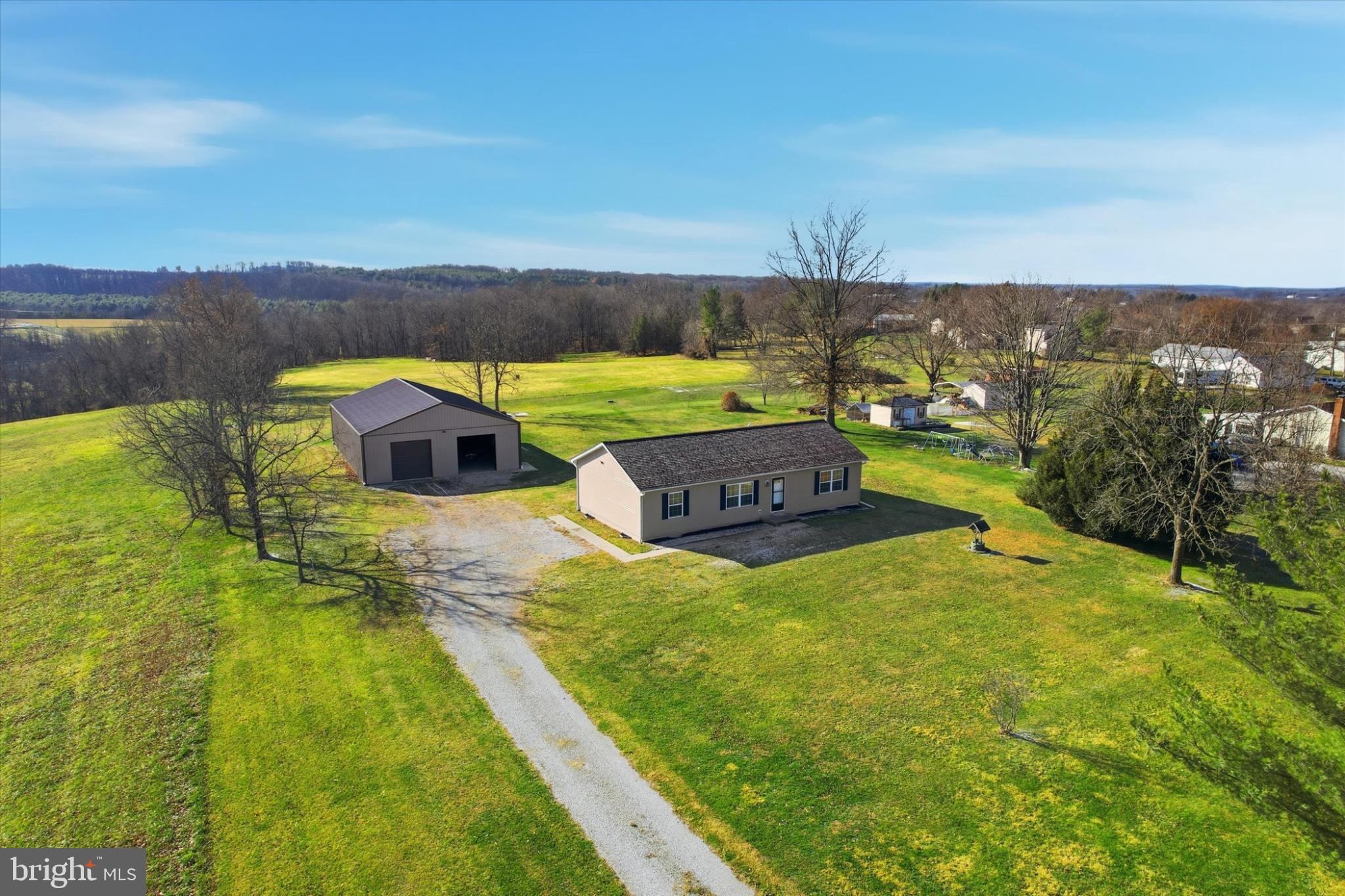 893 Georgetown Road Littlestown, PA 17340 - Photo 30 of 35 a view of a swimming pool with an outdoor seating and yard