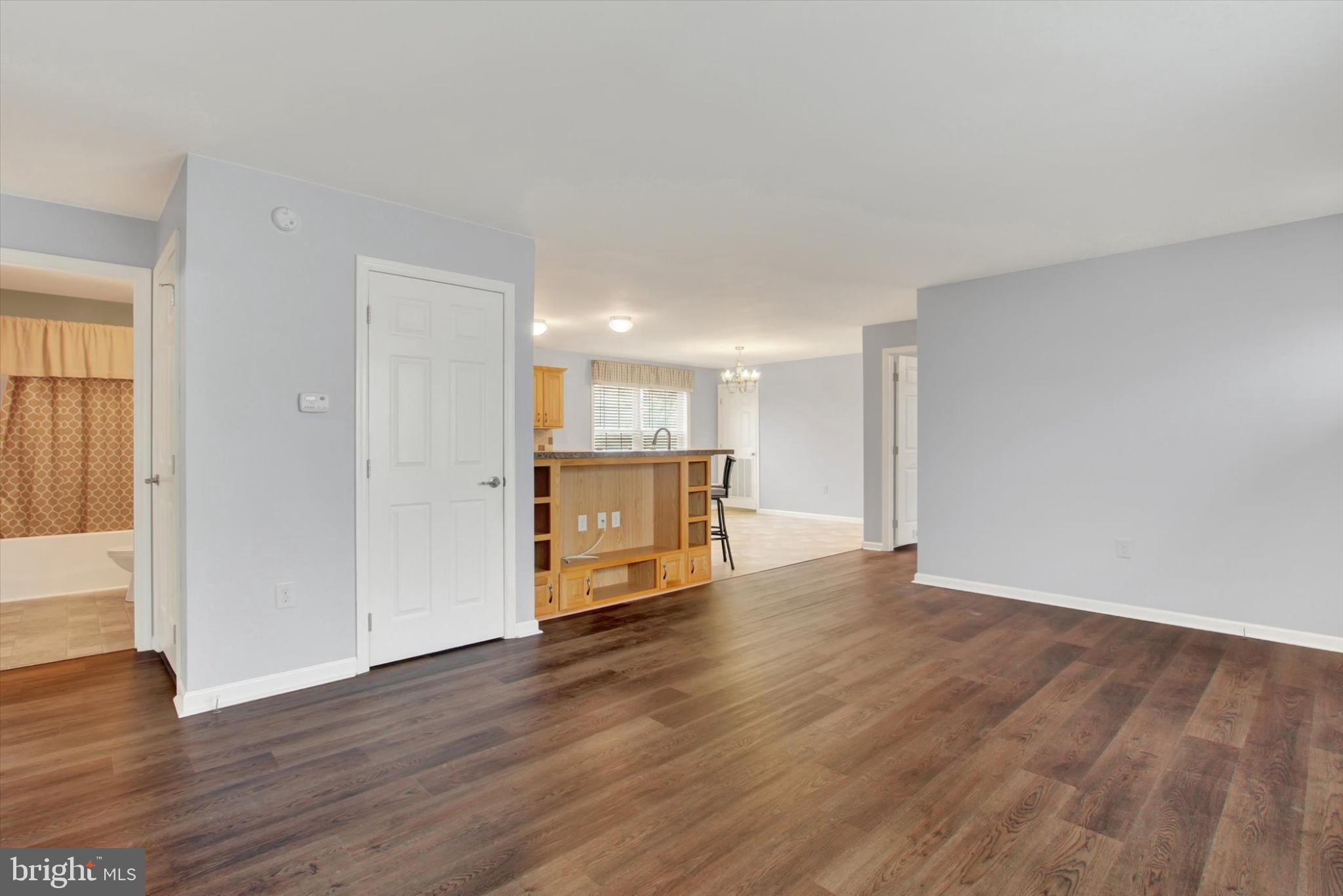 893 Georgetown Road Littlestown, PA 17340 - Photo 6 of 35 a view of an empty room with wooden floor and a window