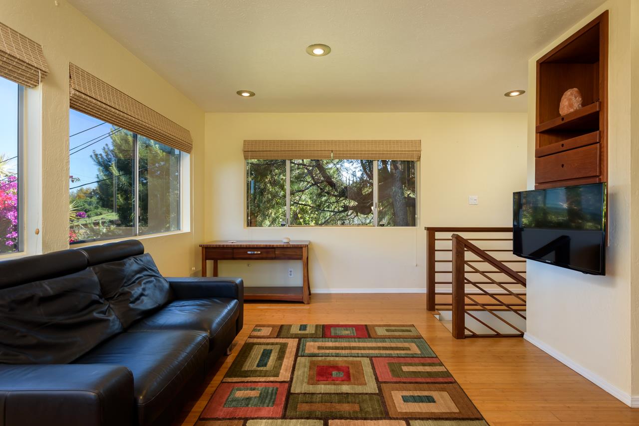 3515 Lower Kula Road Kula, HI 96790 - Photo 14 of 30 a living room with furniture fireplace and flat screen tv