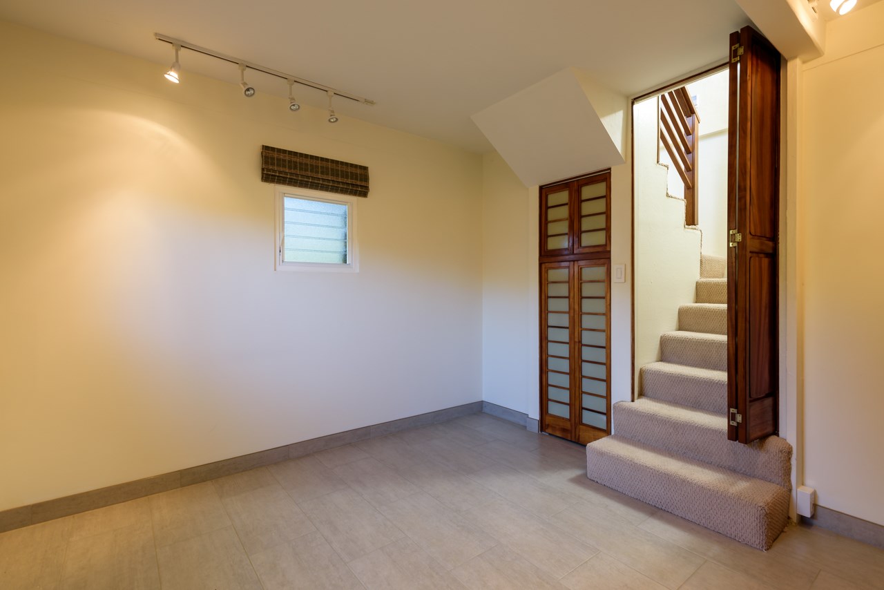 3515 Lower Kula Road Kula, HI 96790 - Photo 18 of 30 a view of an empty room with a staircase