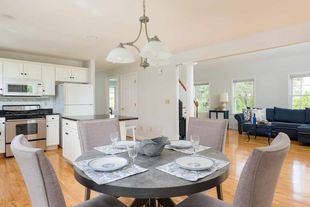 376 Monomoscoy Road Mashpee, MA 02649 - Photo 13 of 31 a view of a dining room with furniture