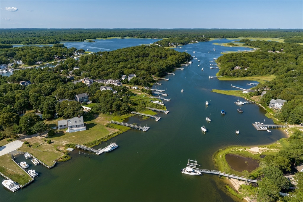 376 Monomoscoy Road Mashpee, MA 02649 - Photo 2 of 31 a view of a house with a yard