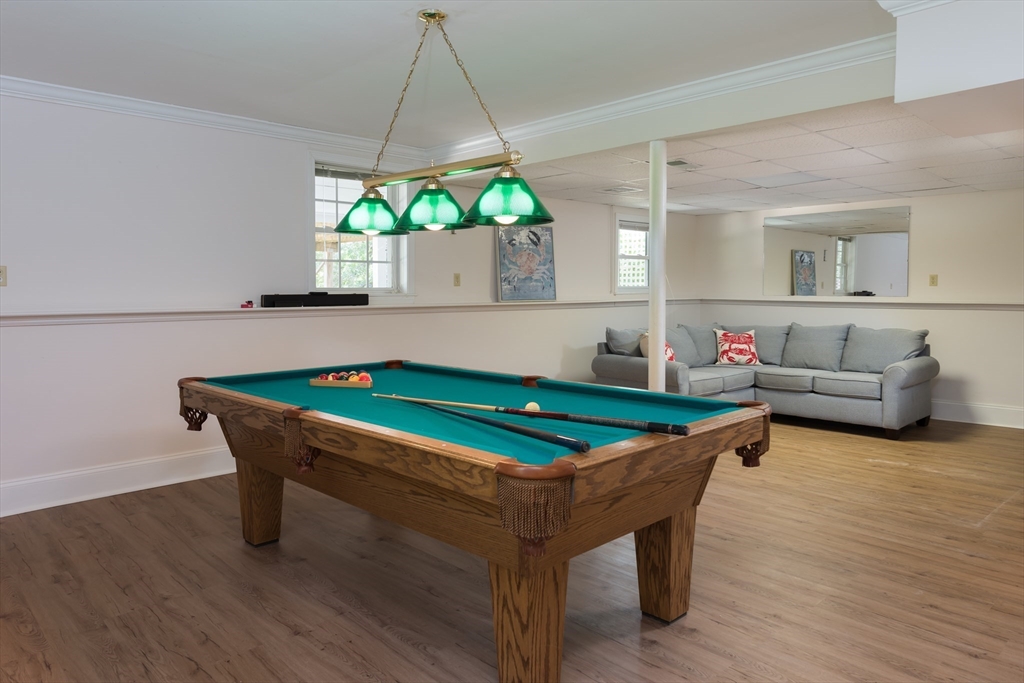 376 Monomoscoy Road Mashpee, MA 02649 - Photo 27 of 31 a room with furniture and a table