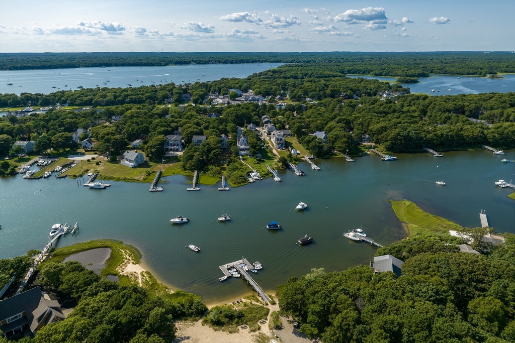 376 Monomoscoy Road Mashpee, MA 02649 - Photo 29 of 31 an aerial view of a house with a yard and lake view
