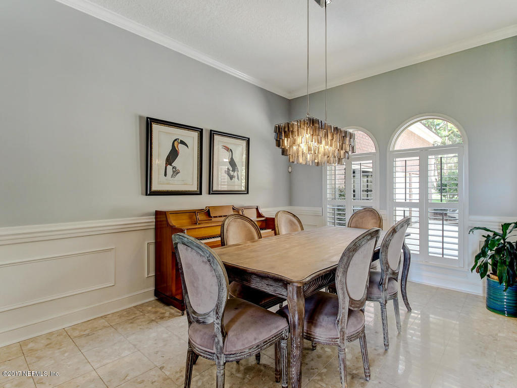 1198 Neck Road Ponte Vedra Beach, FL 32082 - Photo 23 of 101 a view of a dining room and livingroom with furniture window and wooden floor