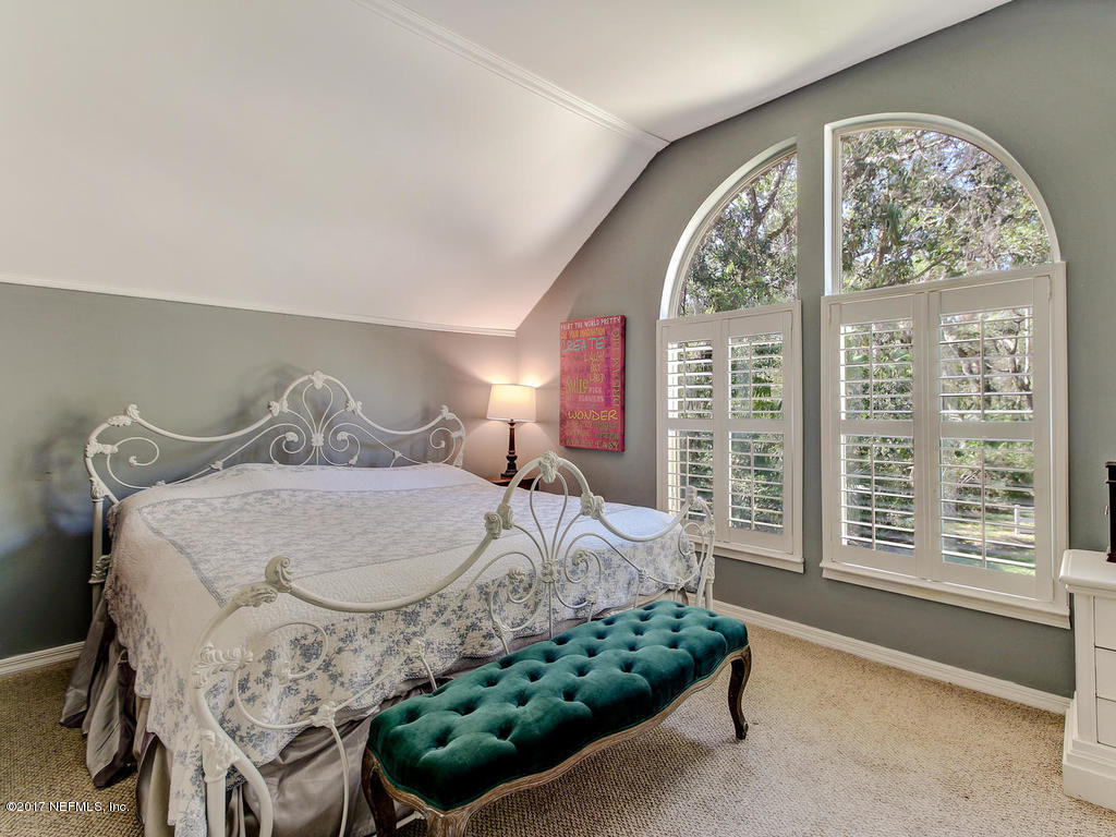 1198 Neck Road Ponte Vedra Beach, FL 32082 - Photo 60 of 101 a bedroom with a large bed and a large window