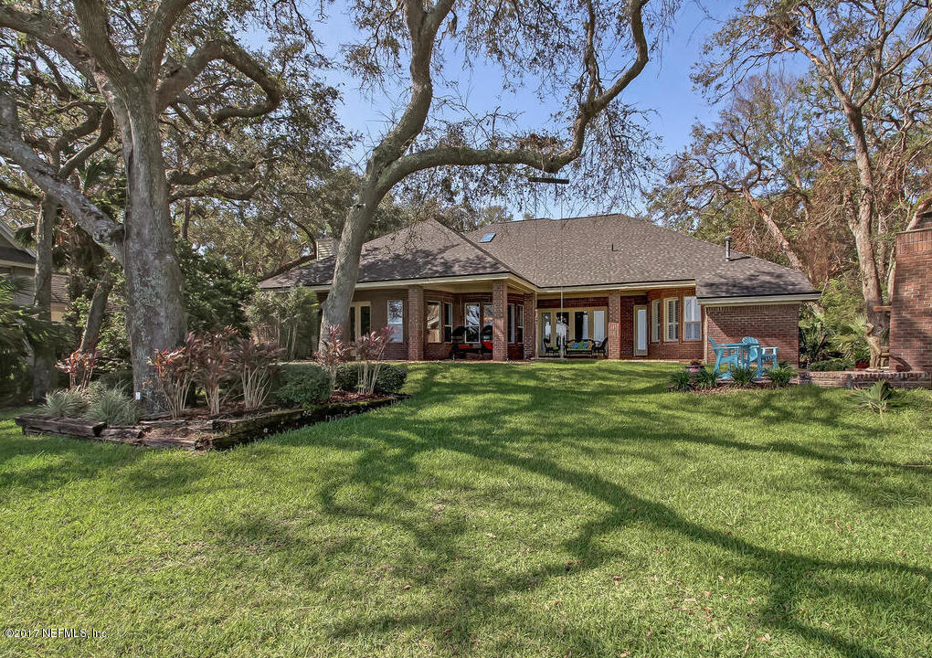 1198 Neck Road Ponte Vedra Beach, FL 32082 - Photo 83 of 101 a front view of a house with a garden