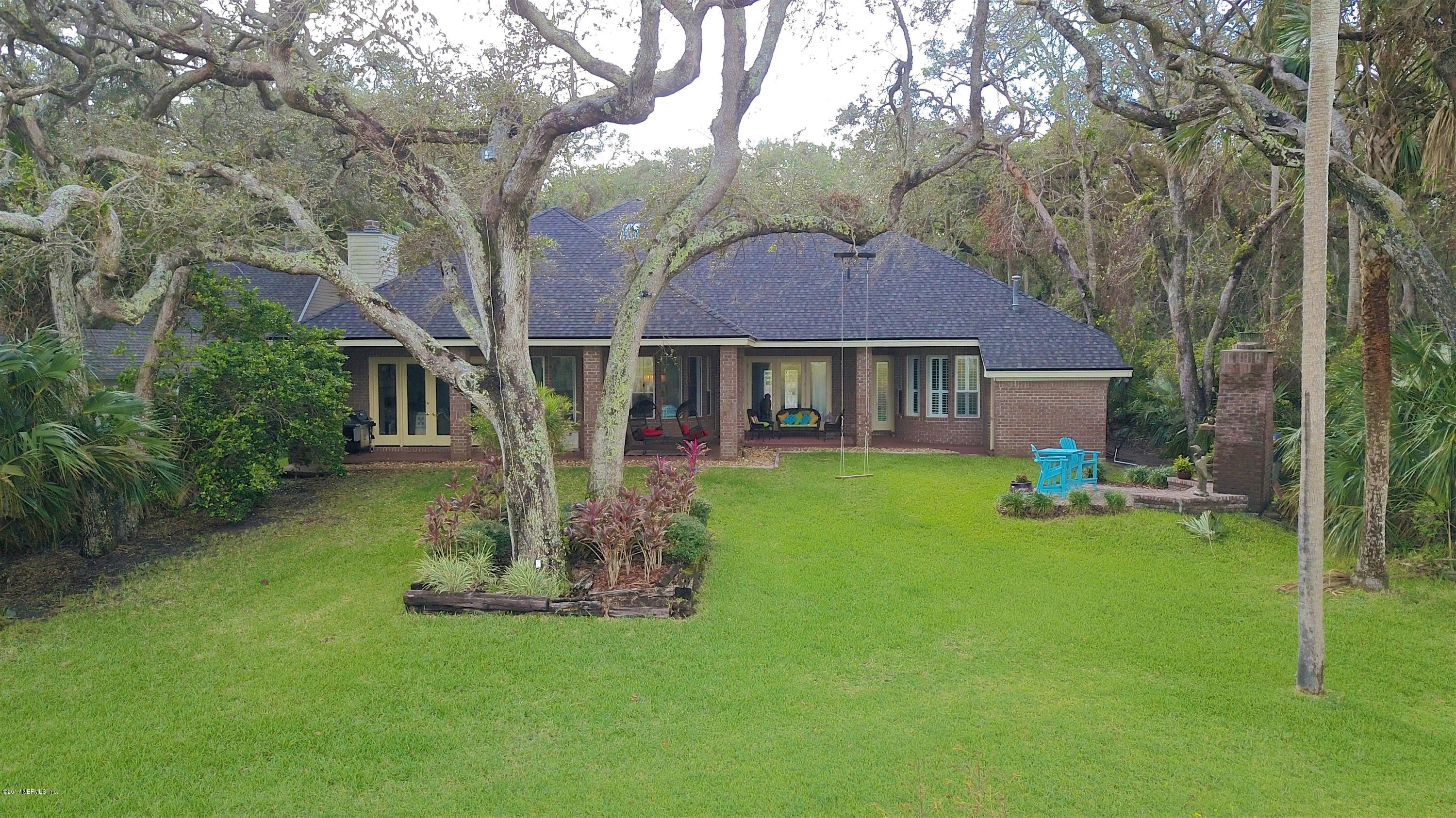 1198 Neck Road Ponte Vedra Beach, FL 32082 - Photo 87 of 101 a front view of a house with garden