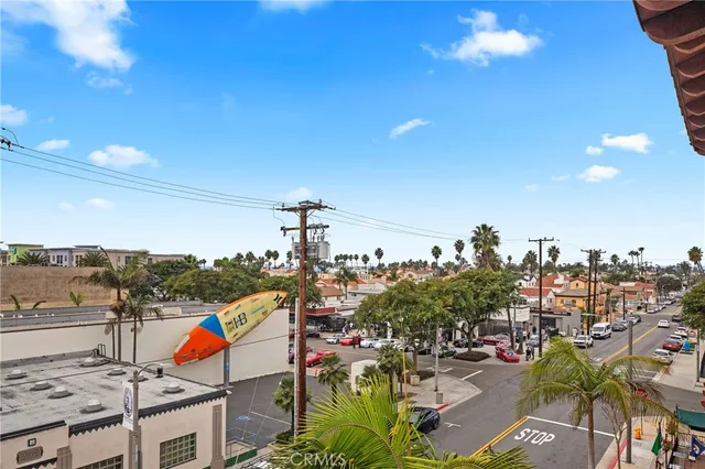 a row of palm trees in front of a building