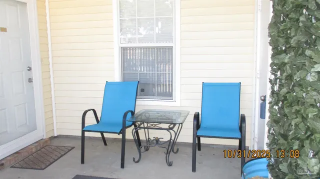 a view of a room with a table and chairs and couches chair