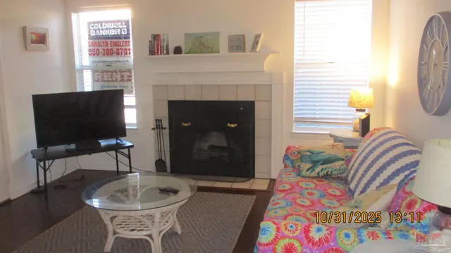 a living room with furniture and a fireplace