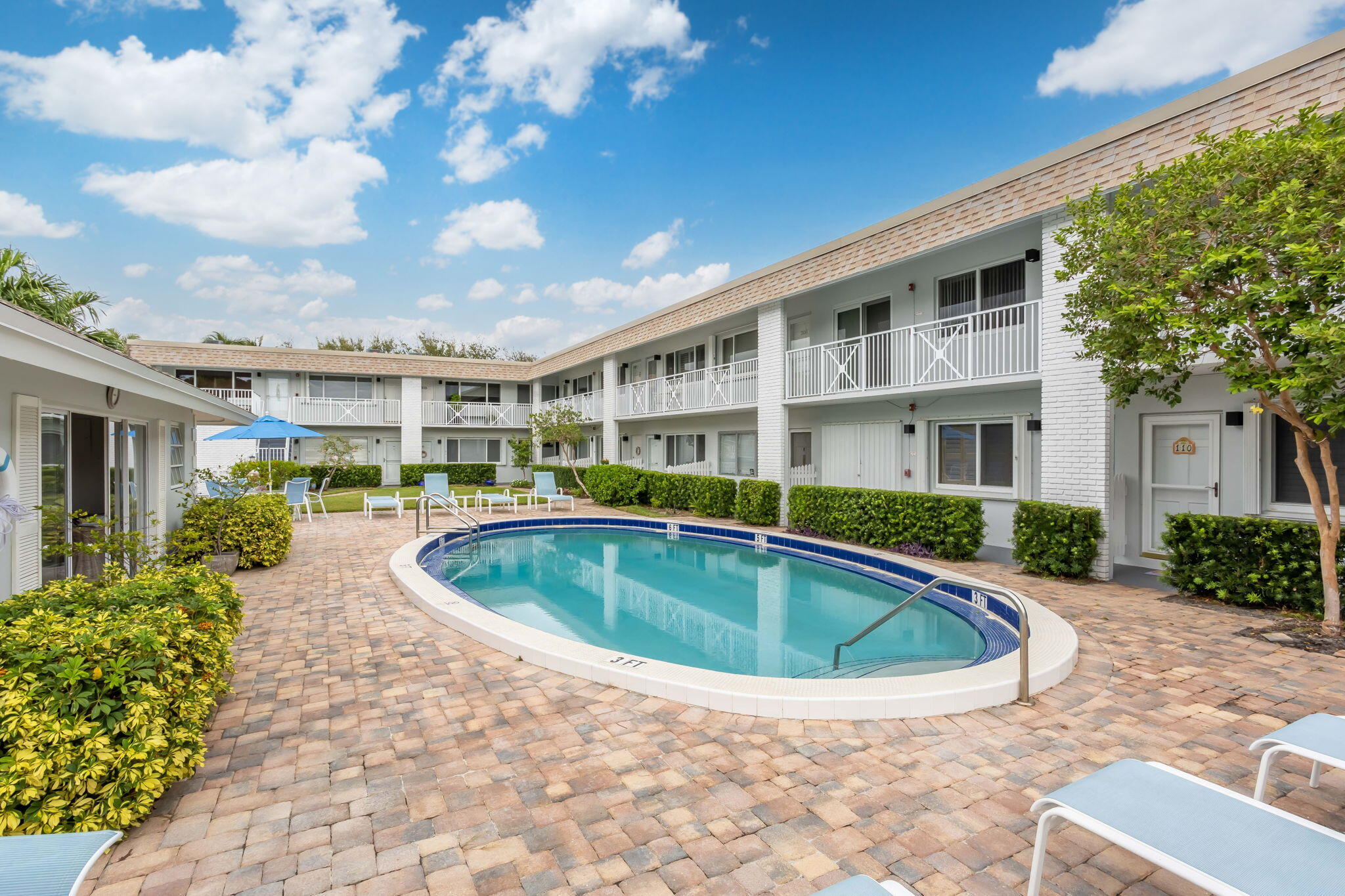1001 Northeast 8th Avenue, Unit 112 Delray Beach, FL 33483 - Photo 18 of 25 a view of outdoor space yard swimming pool and patio