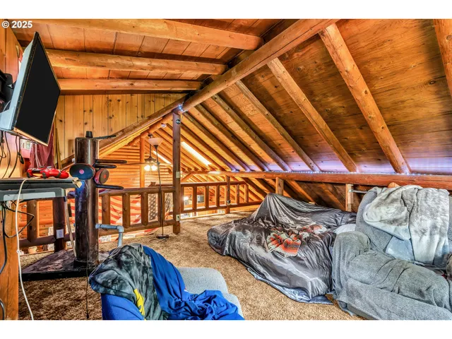 a bedroom with a bed and a bookshelf
