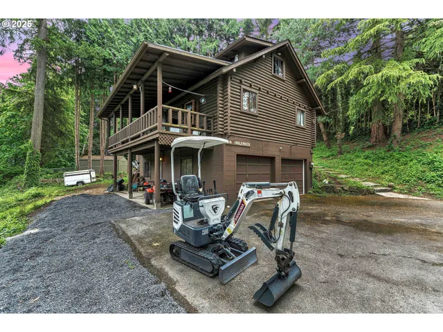 a view of a house with backyard porch and sitting area