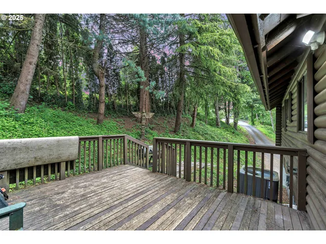 a view of backyard with deck and outdoor seating