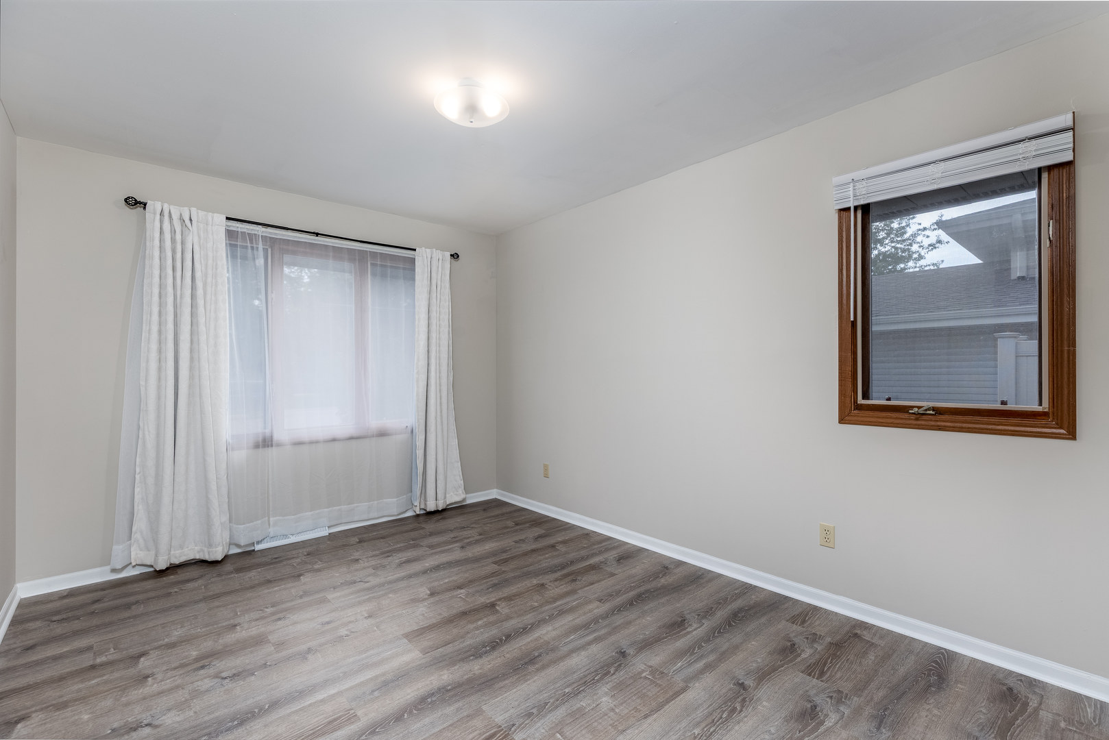 1001 4-H Road Ottawa, IL 61350 - Photo 19 of 25 a view of an empty room with wooden floor and a window