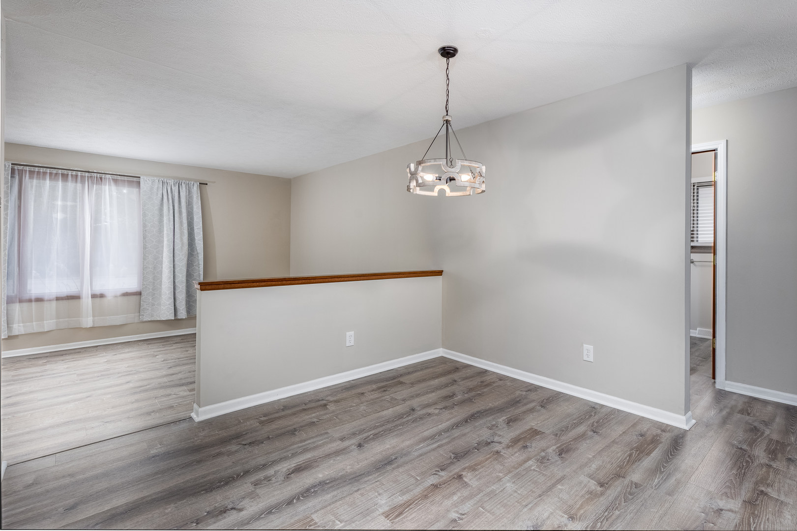 1001 4-H Road Ottawa, IL 61350 - Photo 6 of 25 a view of empty room with wooden floor and fan