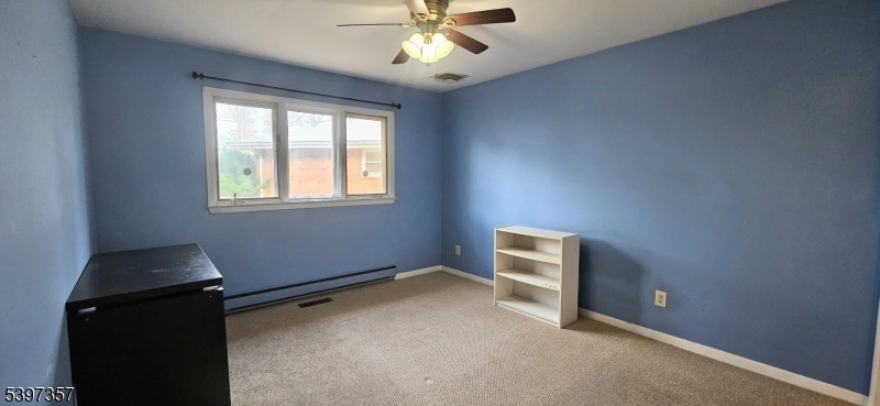 934 Lowden Avenue Union, NJ 07083 - Photo 11 of 25 wooden floor and window in an empty room