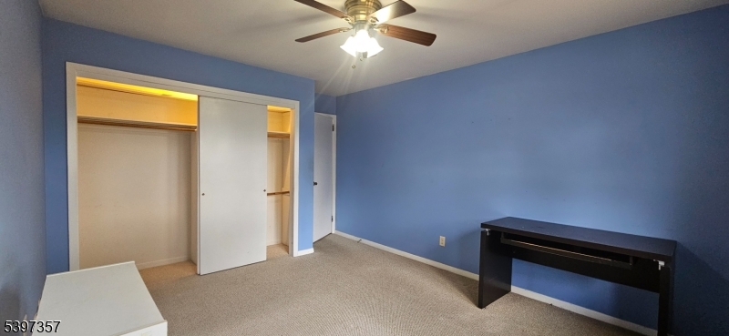 934 Lowden Avenue Union, NJ 07083 - Photo 12 of 25 a bedroom with a bed and a ceiling fan