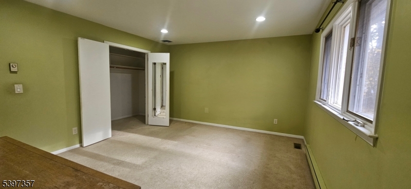 934 Lowden Avenue Union, NJ 07083 - Photo 13 of 25 an empty room with windows