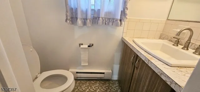 a bathroom with a sink and toilet