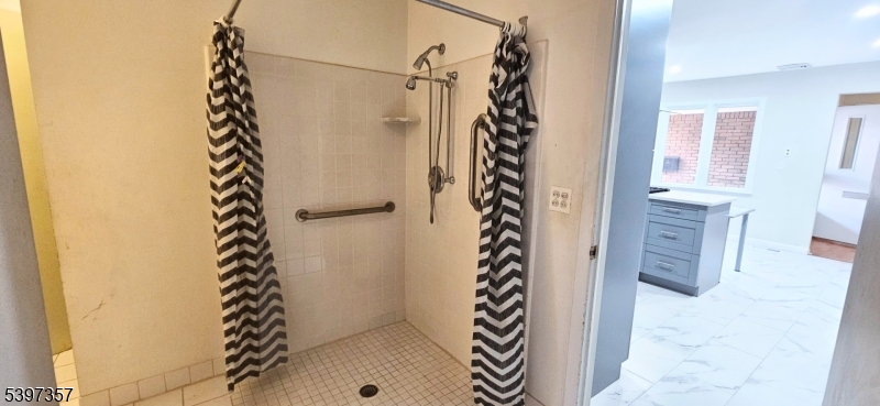 934 Lowden Avenue Union, NJ 07083 - Photo 22 of 25 a bathroom with a shower curtain and a sink