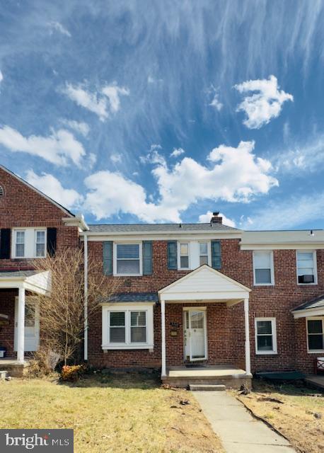 3709 Monterey Road Baltimore, MD 21218 - Photo 1 of 30 a front view of a house with a yard