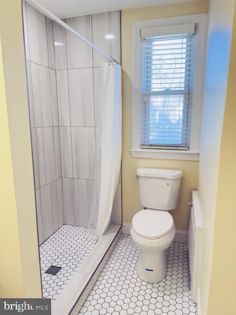 3709 Monterey Road Baltimore, MD 21218 - Photo 17 of 30 a bathroom with a toilet and a shower