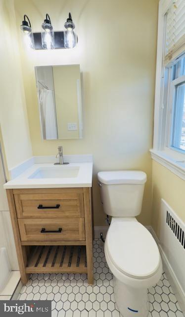 3709 Monterey Road Baltimore, MD 21218 - Photo 18 of 30 a bathroom with a sink toilet and mirror