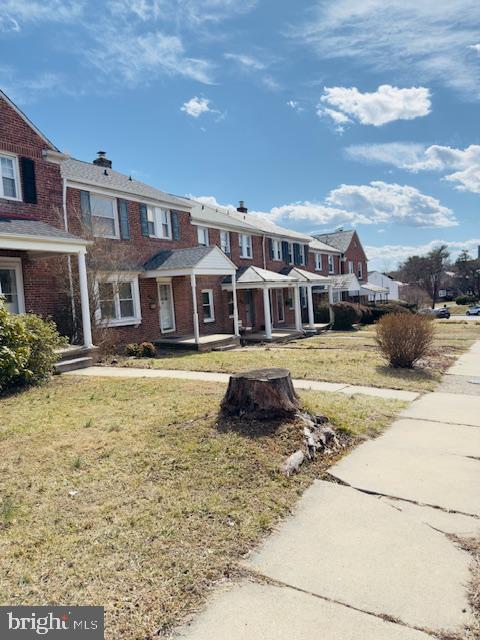 3709 Monterey Road Baltimore, MD 21218 - Photo 2 of 30 a front view of a house with a yard