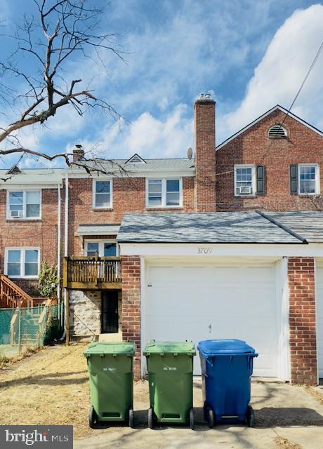 3709 Monterey Road Baltimore, MD 21218 - Photo 26 of 30 a front view of a house with garden