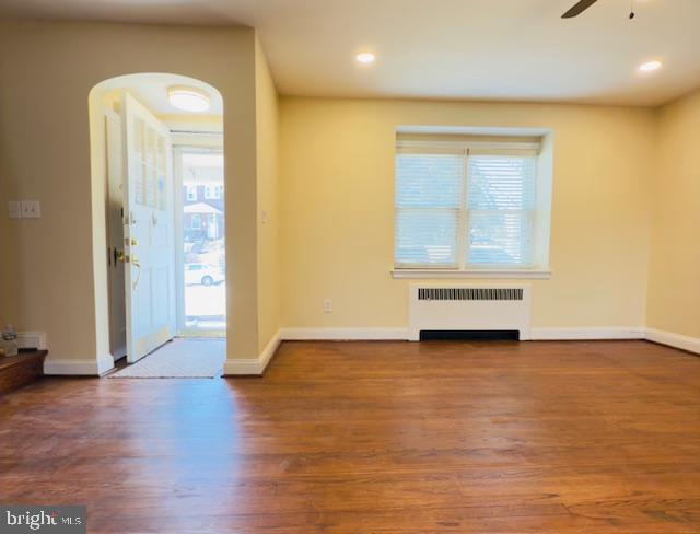 3709 Monterey Road Baltimore, MD 21218 - Photo 3 of 30 an empty room with wooden floor and windows