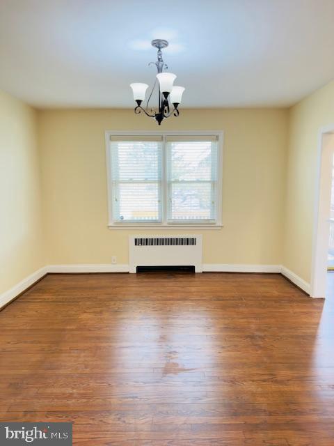 3709 Monterey Road Baltimore, MD 21218 - Photo 5 of 30 wooden floor in an empty room with a window