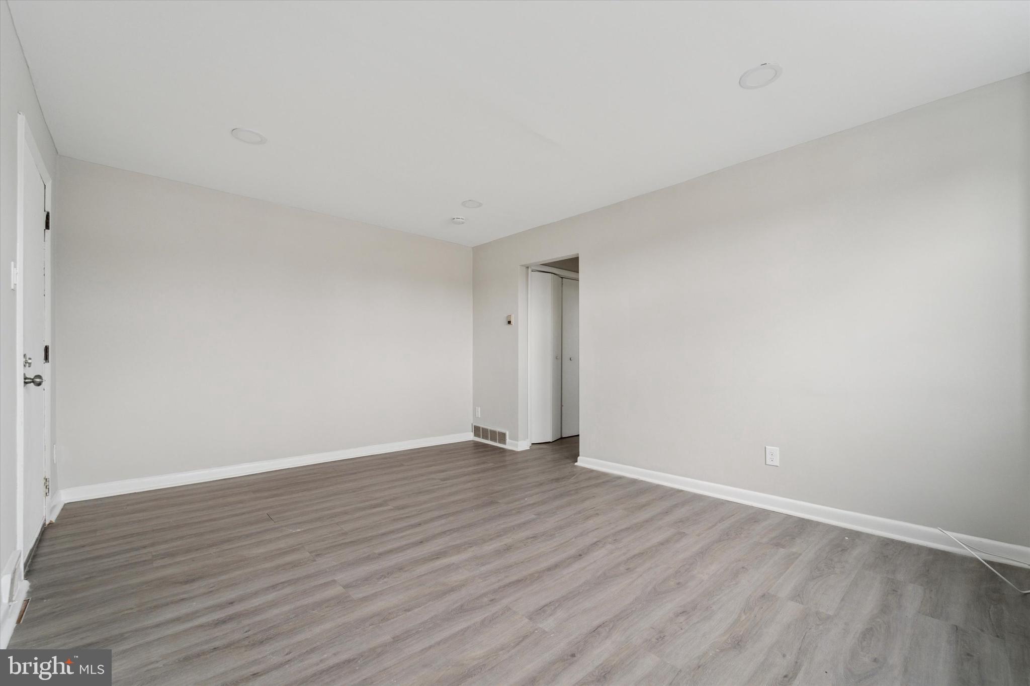 3819-3821 Garrett Road Drexel Hill, PA 19026 - Photo 11 of 24 a view of an empty room with wooden floor