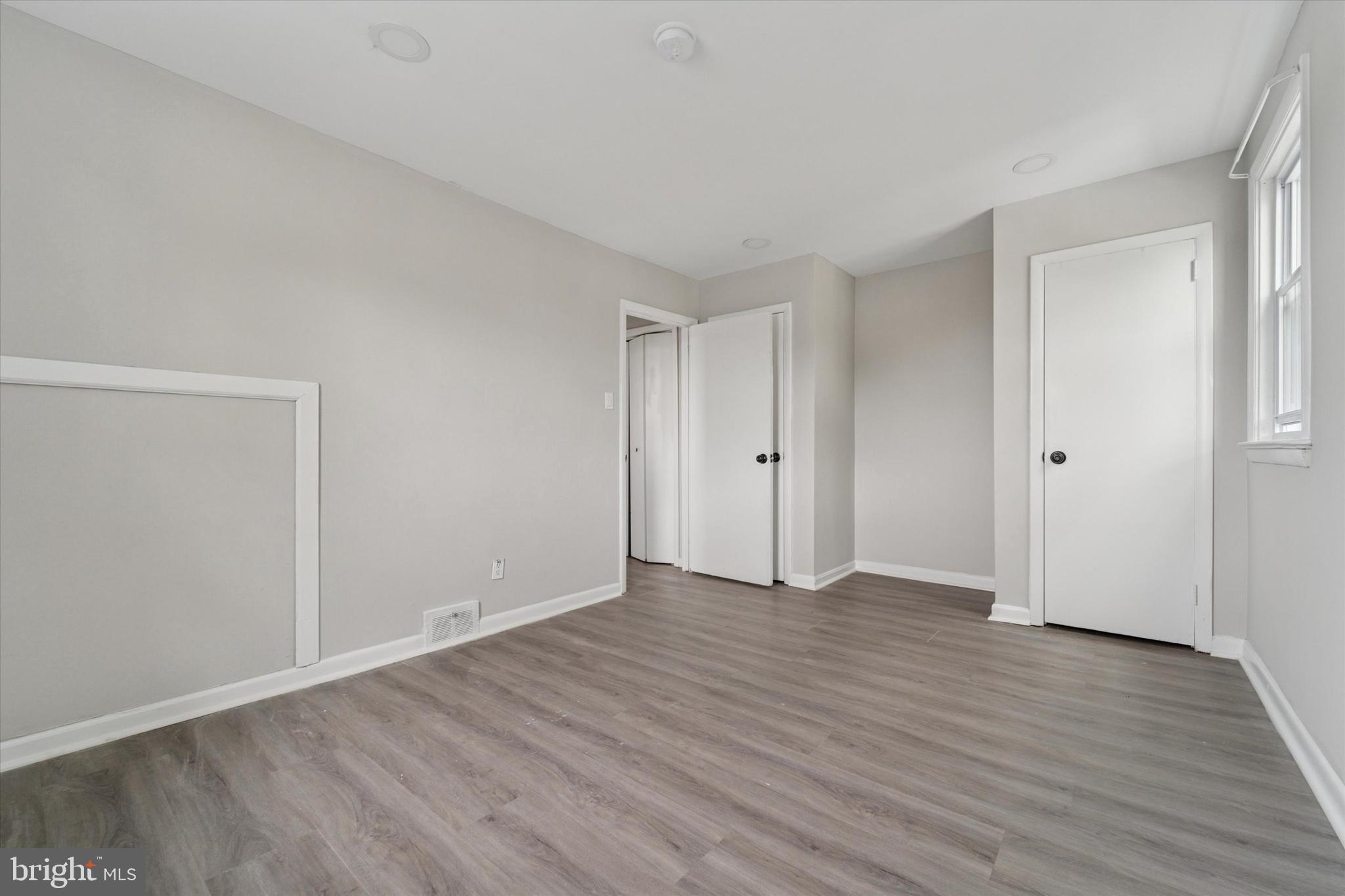 3819-3821 Garrett Road Drexel Hill, PA 19026 - Photo 18 of 24 a view of an empty room with wooden floor