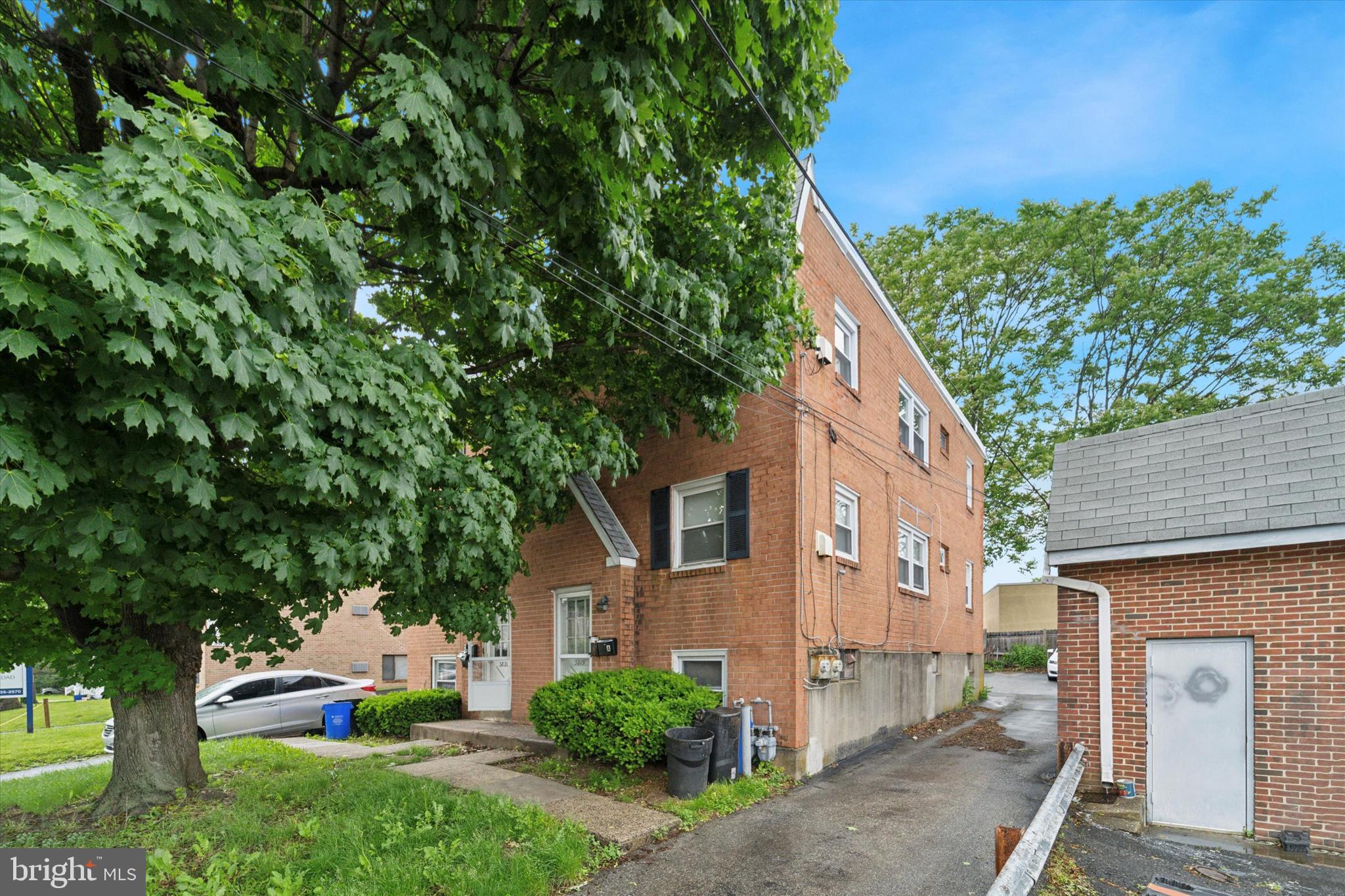 3819-3821 Garrett Road Drexel Hill, PA 19026 - Photo 2 of 24 a front view of a house with a yard
