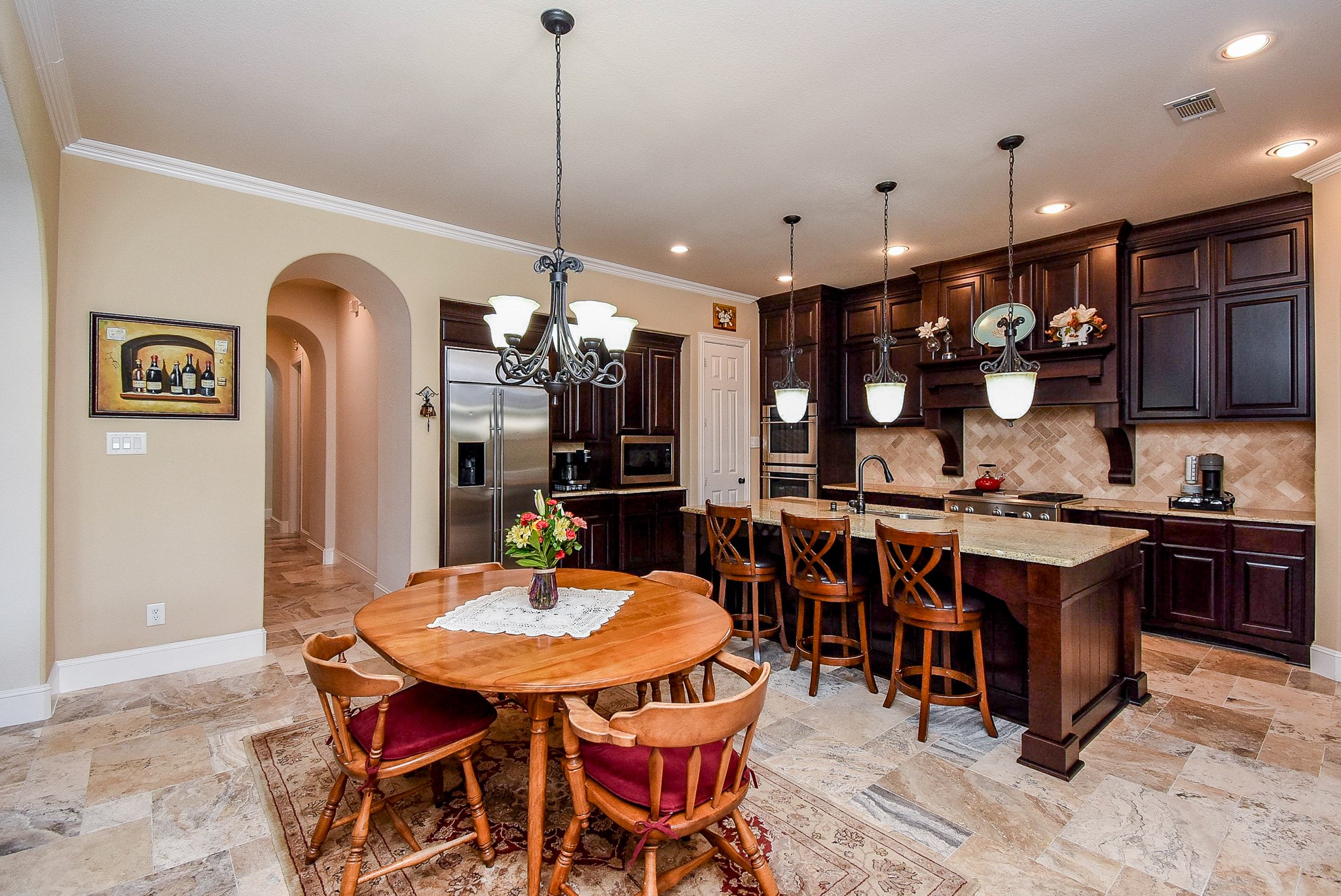 27427 Guthrie Ridge Lane Katy, TX 77494 - Photo 19 of 48 a large kitchen with a table and chairs