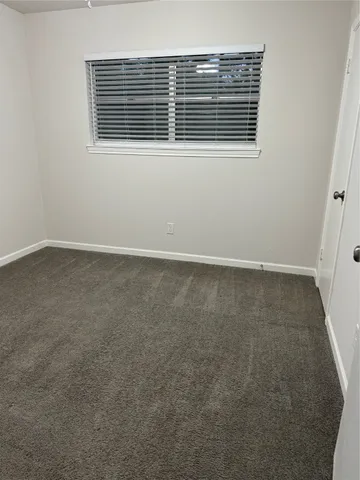 an empty room with wooden floor