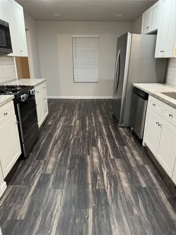 a view of a kitchen from the kitchen