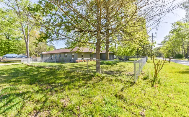 a swimming pool with trees in the background