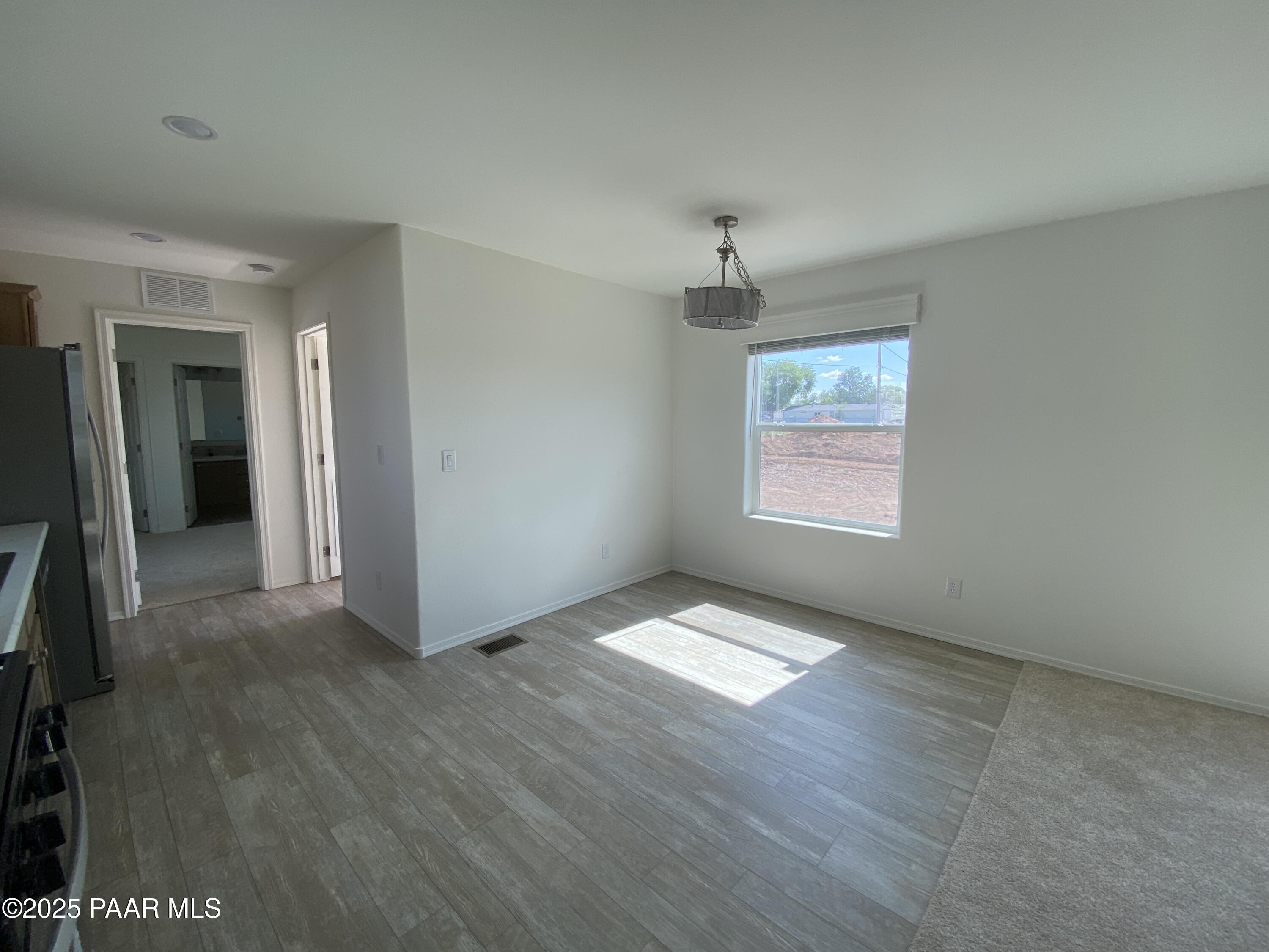 215 West Venice Way Paulden, AZ 86334 - Photo 25 of 40 wooden floor in an empty room with a window